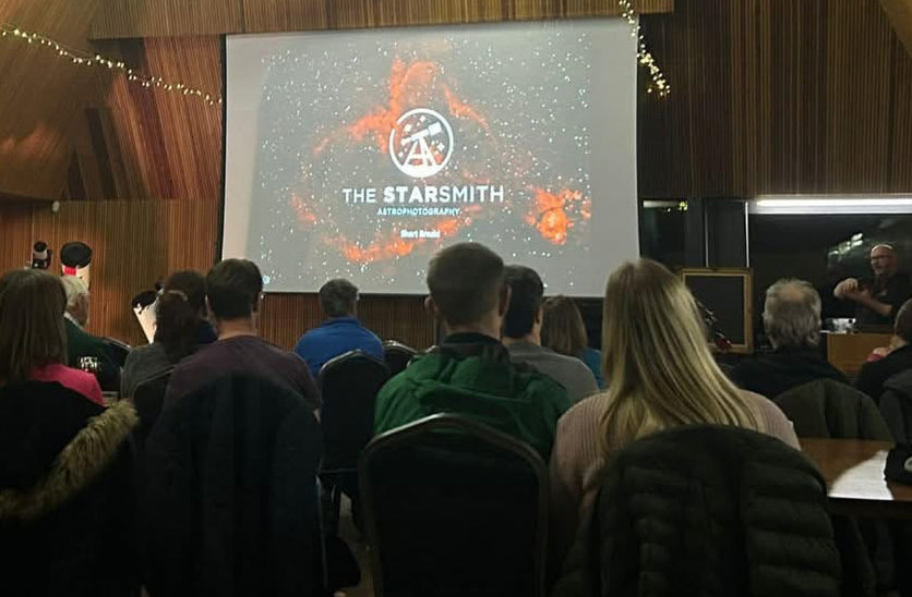 An audience enjoying an interactive astronomy presentation
